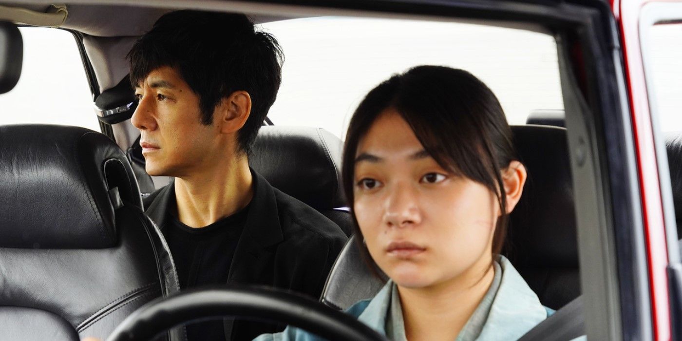 Hidetoshi Nishijima and Toko Miura as Yuusuke and Misaki in the car in the 2021 film Drive My Car.
