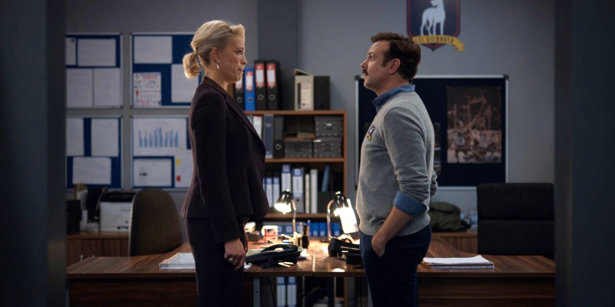 Jason Sudeikis as Ted Lasso and Hannah Waddingham as Rebecca Welton speak at 