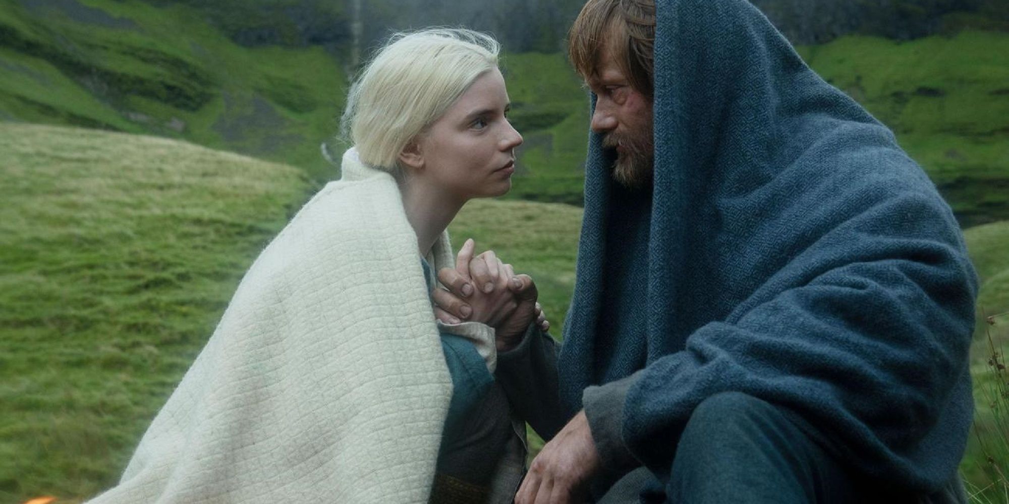 Anya Taylor-Joy as Olga and Alexander Skarsgård as Amleth look lovingly into each other's eyes in The Northerner.