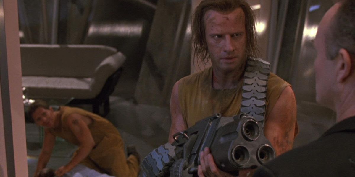 A man is aiming a gun at someone in the Fortress.
