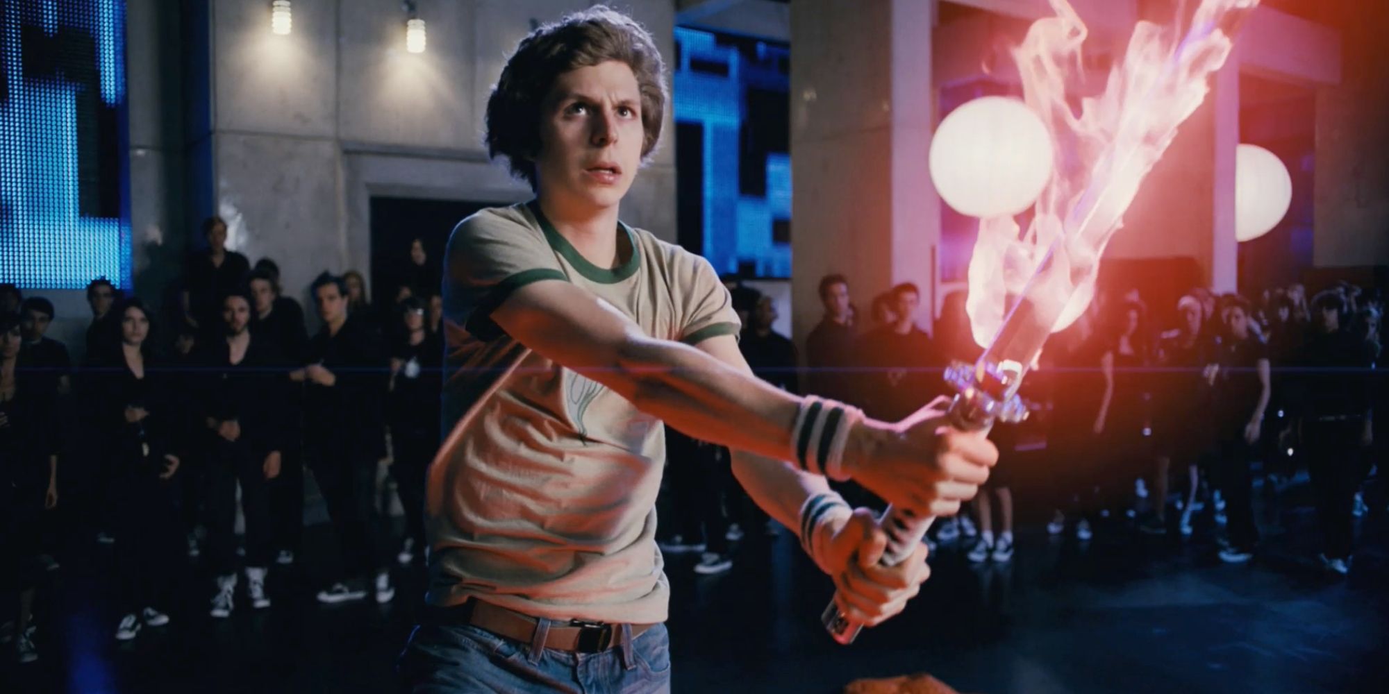 Scott (Michael Cera) wields a flaming sword in Scott Pilgrim vs. the World (2010).