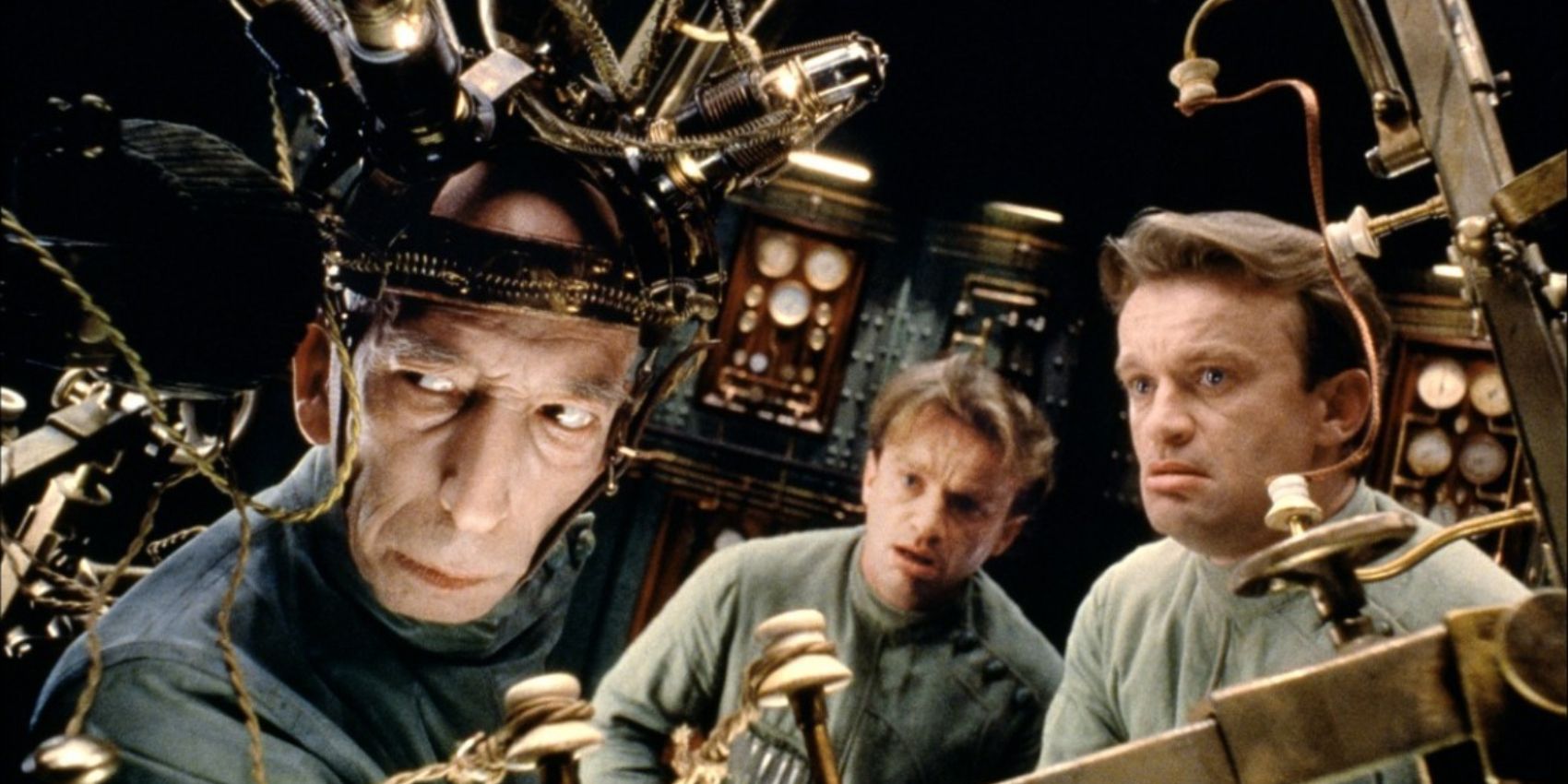 Three men looking in the same direction in City of Lost Children (1995)