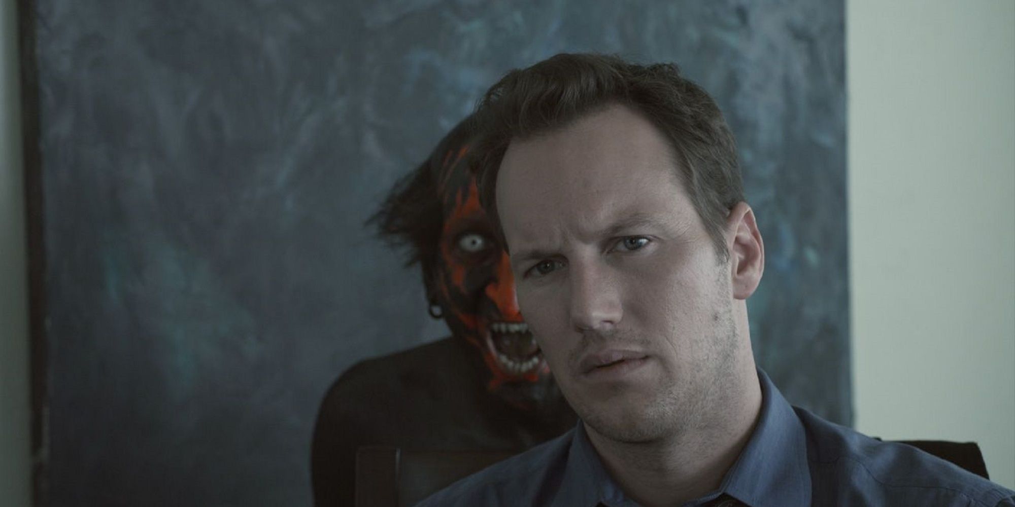 A lipstick-faced demon behind Patrick Wilson's character in Astral.