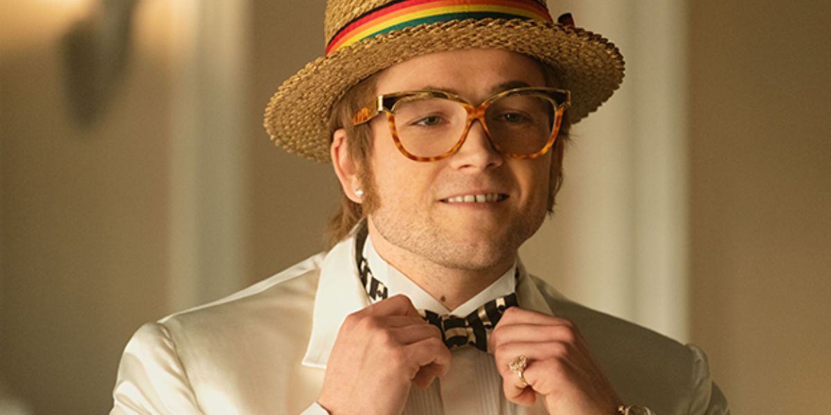 Elton John straightens his bow tie in Rocketman.