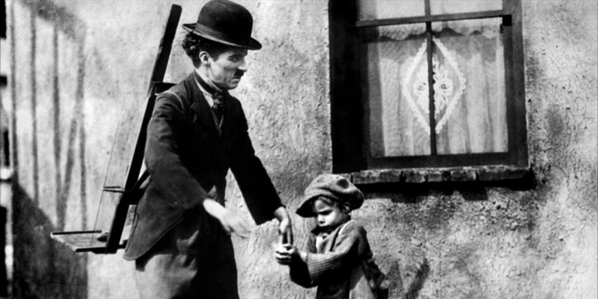 Tramp and his son look out the window