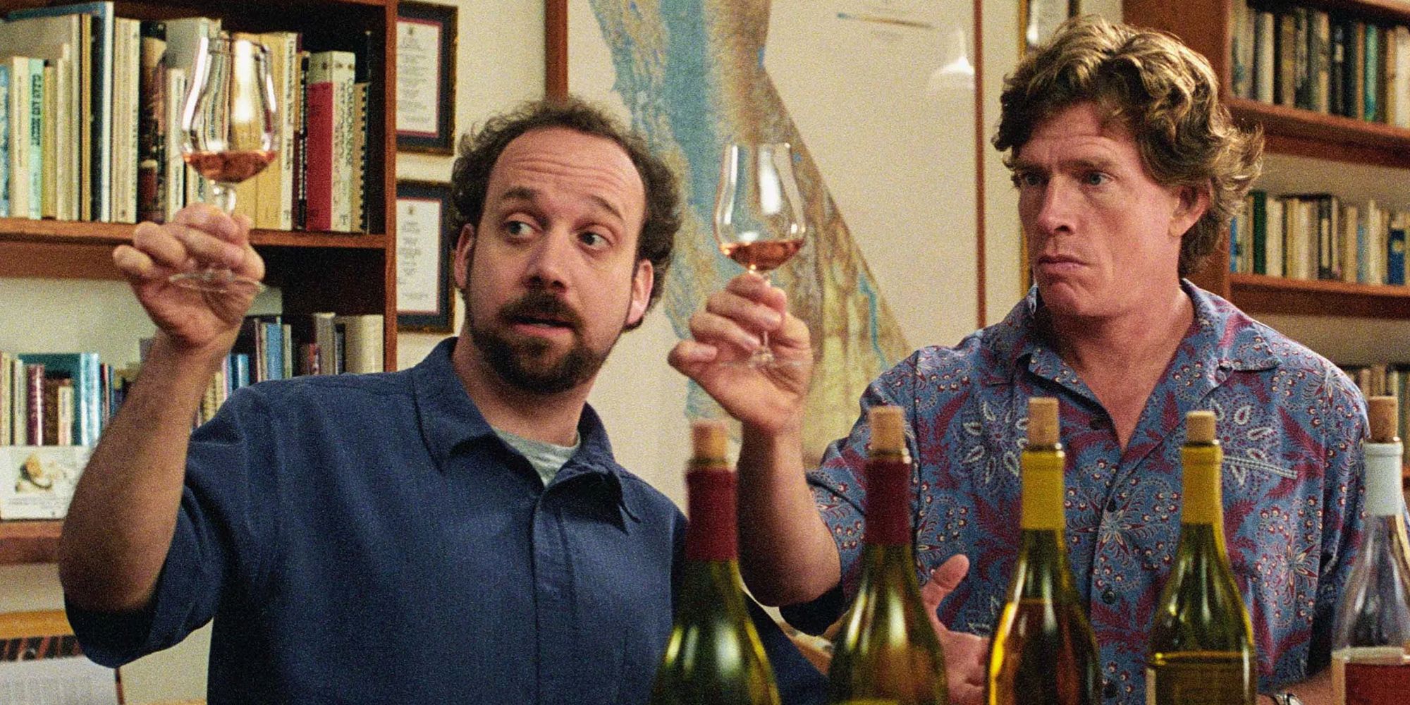 Paul Giamatti and Thomas Haden-Church as Miles and Jack toasting glasses of wine in Roadside.
