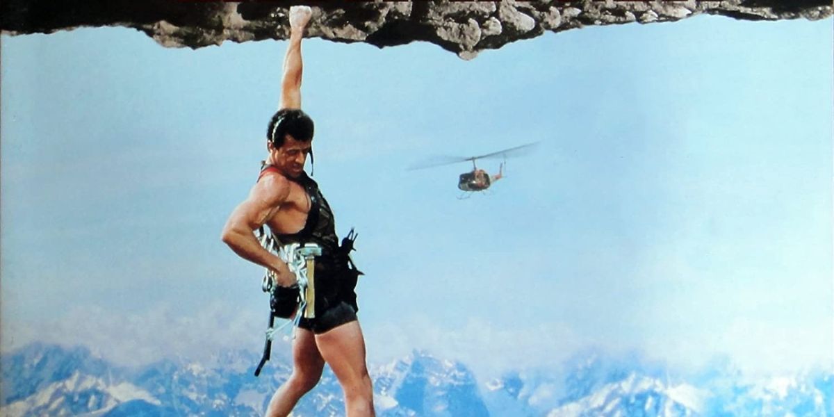 Man hanging on a rock
