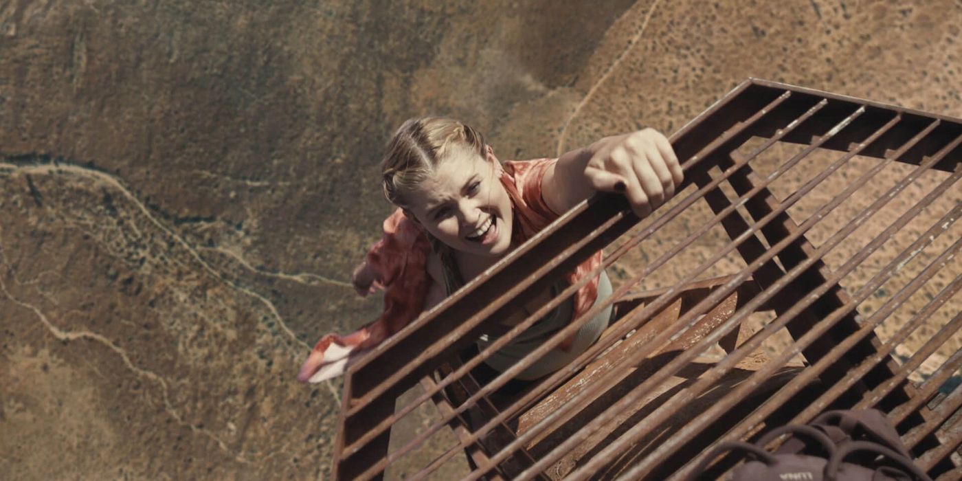 Woman hanging on a ledge