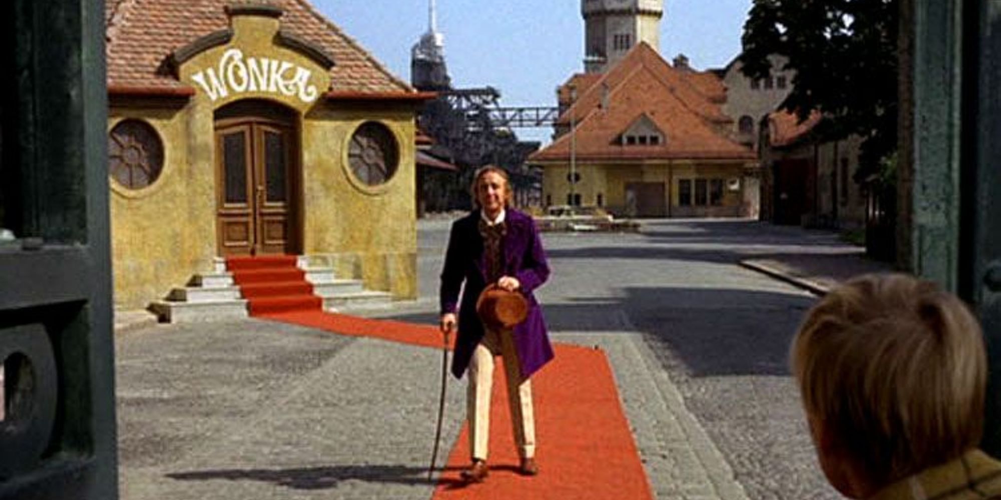 Willy Wonka (Gene Wilder) stands, dazed, moments before falling into a somersault.