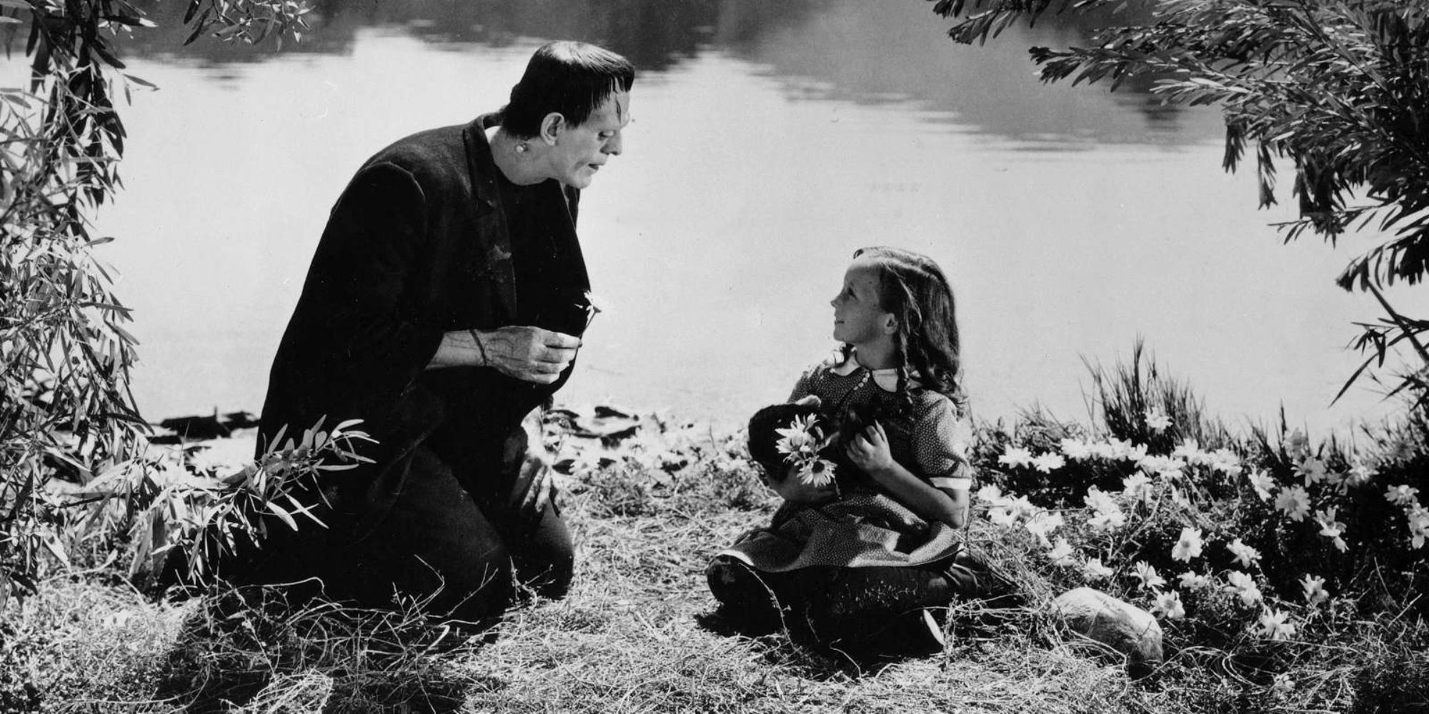 Little girl sits next to a creature by the river