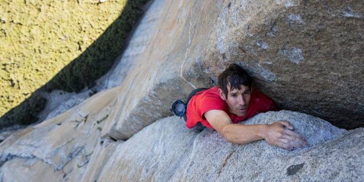 Man climbing a rock