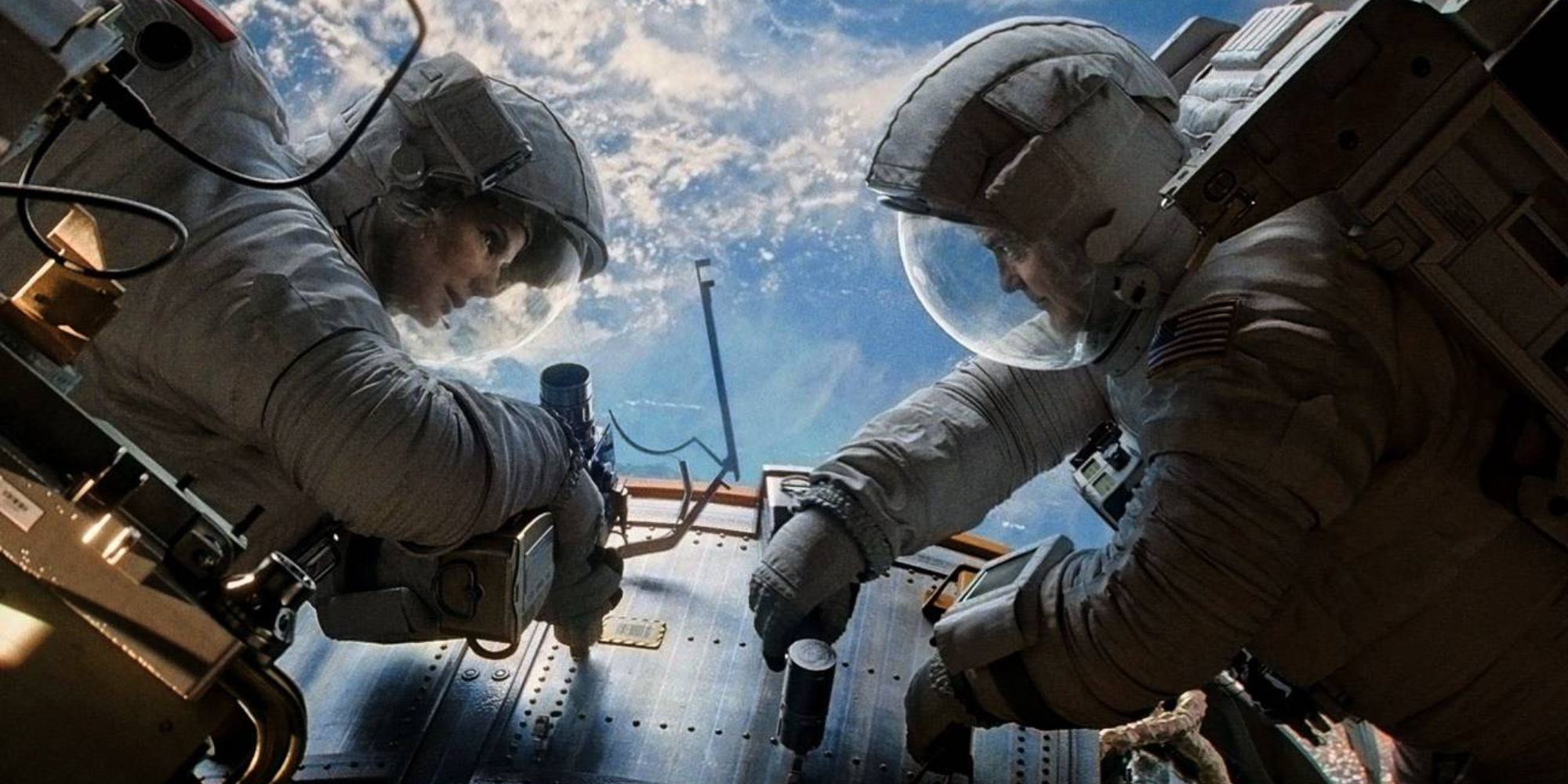 Two astronauts talking about repairs 
