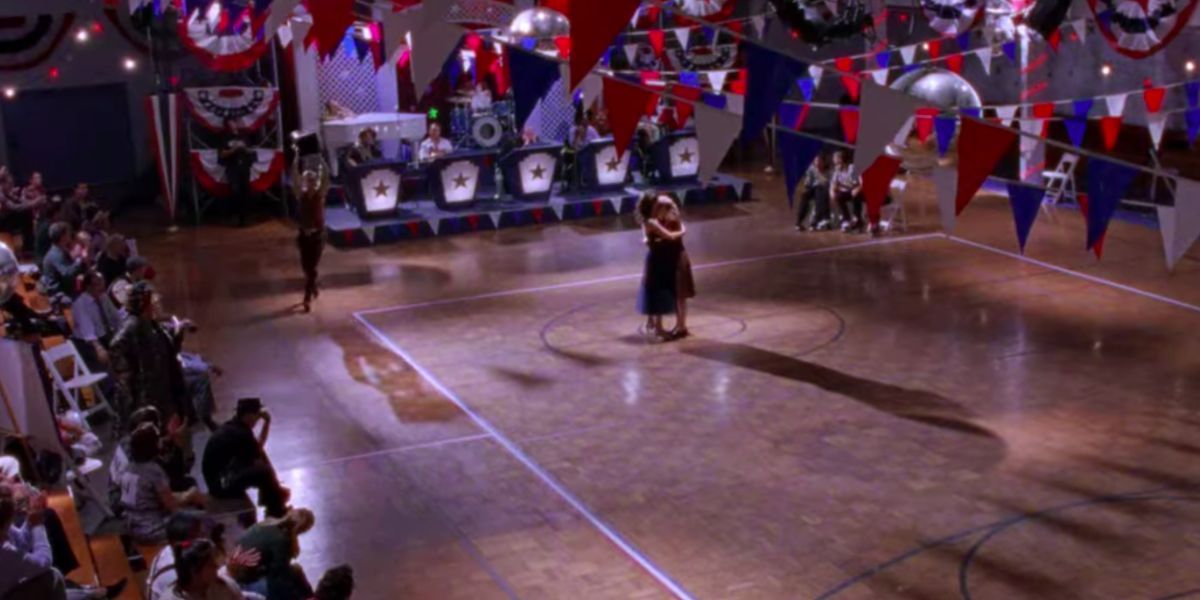 Lorelai and Rory dance in an empty gym in Gilmore Girls.