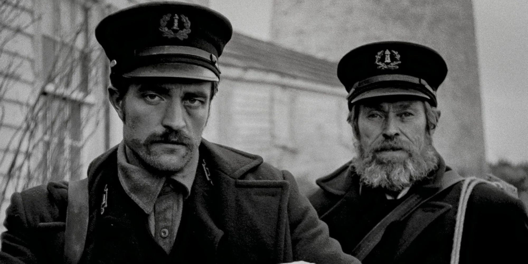 Close-up of Ephraim Winslow (Robert Pattinson) and Thomas Wake (Willem Dafoe) from The Lighthouse