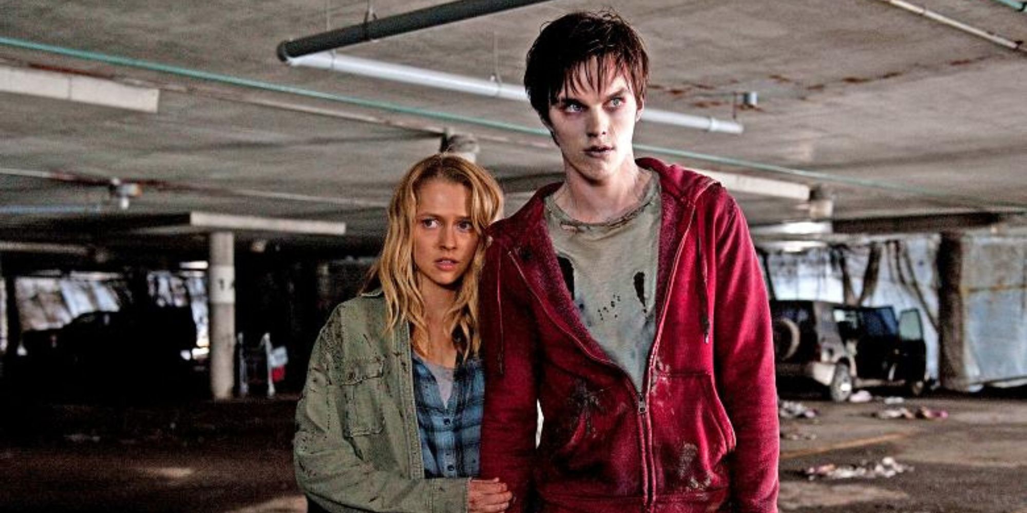 Teresa Palmer holding Nicholas Hoult's hand in Warm Bodies.