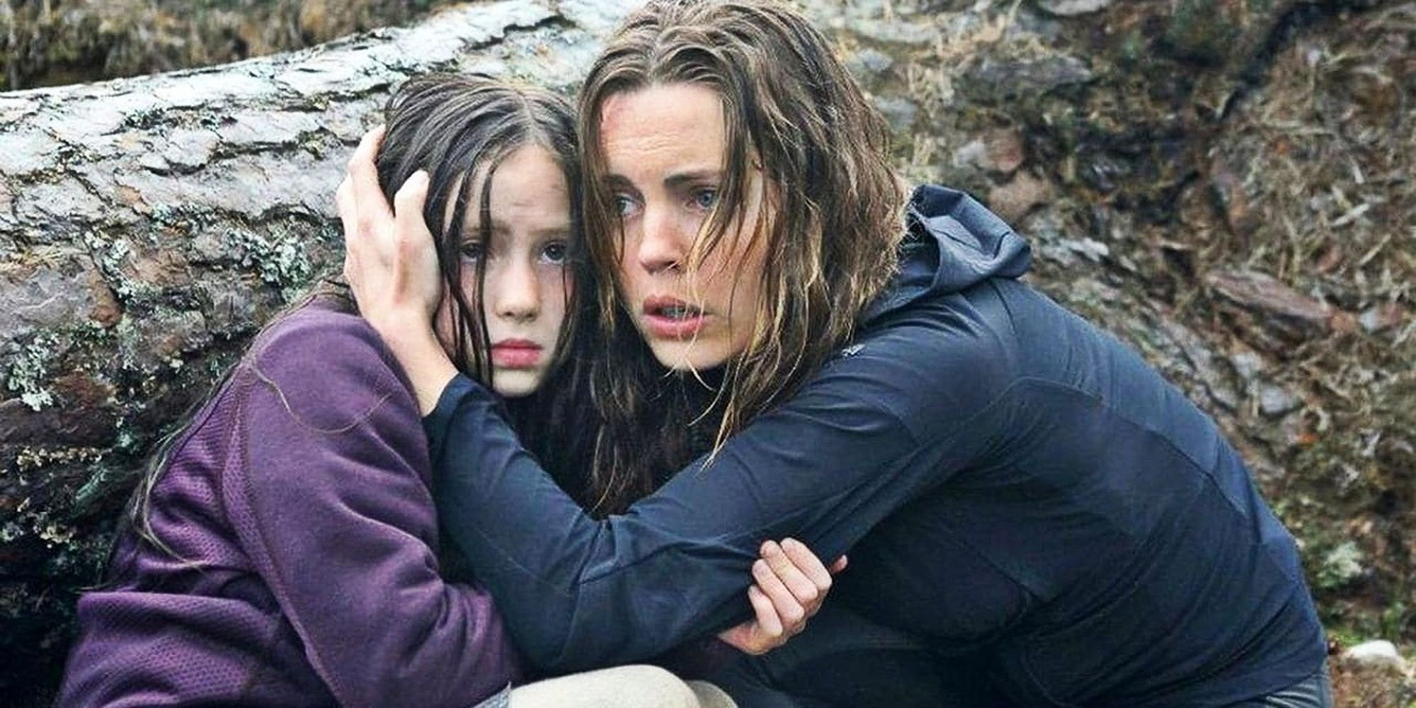 Woman and young girl hiding
