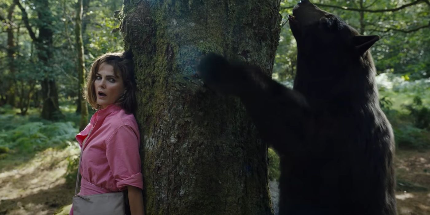 Keri Russell hides from a cocaine bear in Elizabeth Banks' Cocaine Bear.