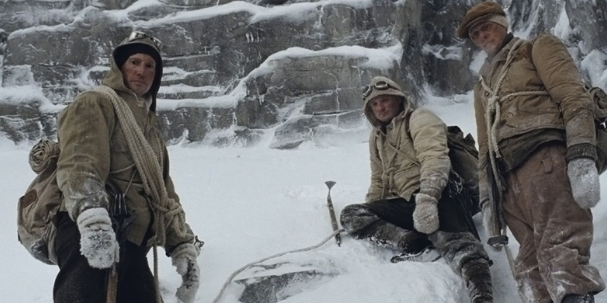 Three men on a snowy mountain