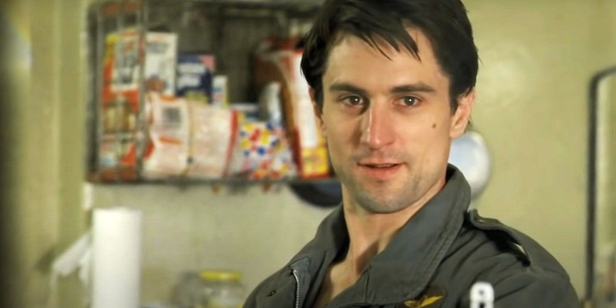 Robert De Niro as Travis Bickle stares at something in Taxi Driver