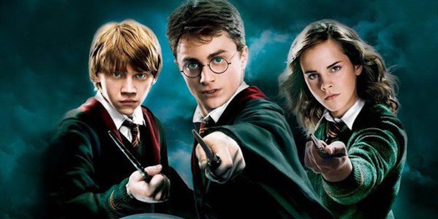 Ron, Harry and Hermione point their wands at the camera in a Harry Potter and the Order of the Phoenix poster.