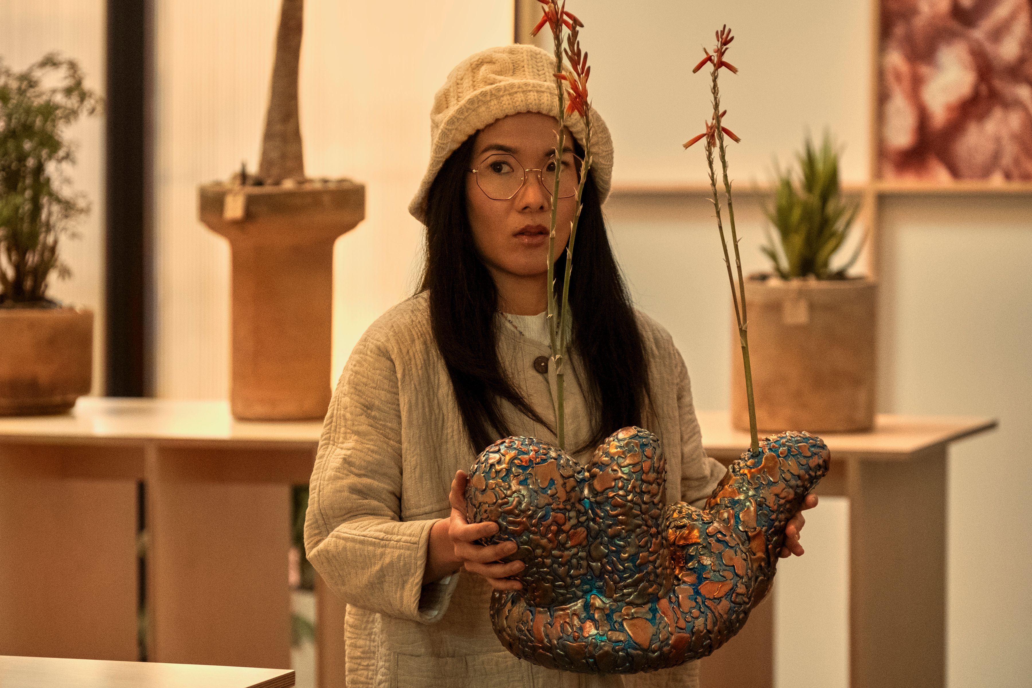 Ali Wong as Amy Lau watering an orchid at BEEF