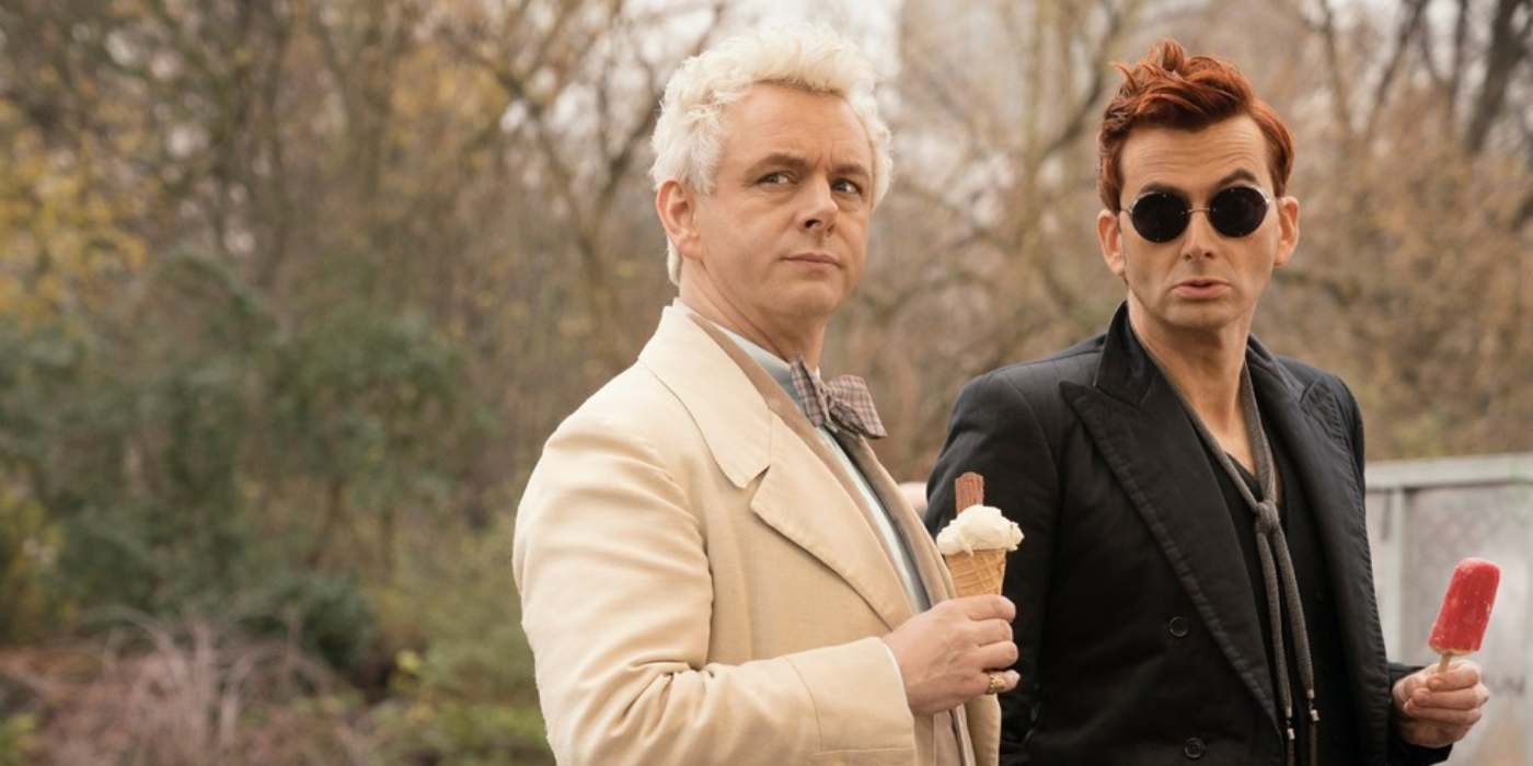 David Tennant and Michael Sheen in Good Omens eat ice cream and popsicles while looking up at something.