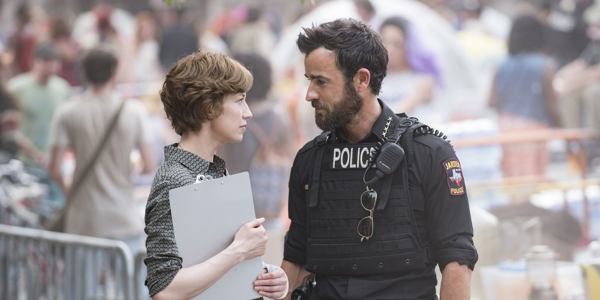 Justin Theroux and Carrie Coon look at each other in The Leftovers.