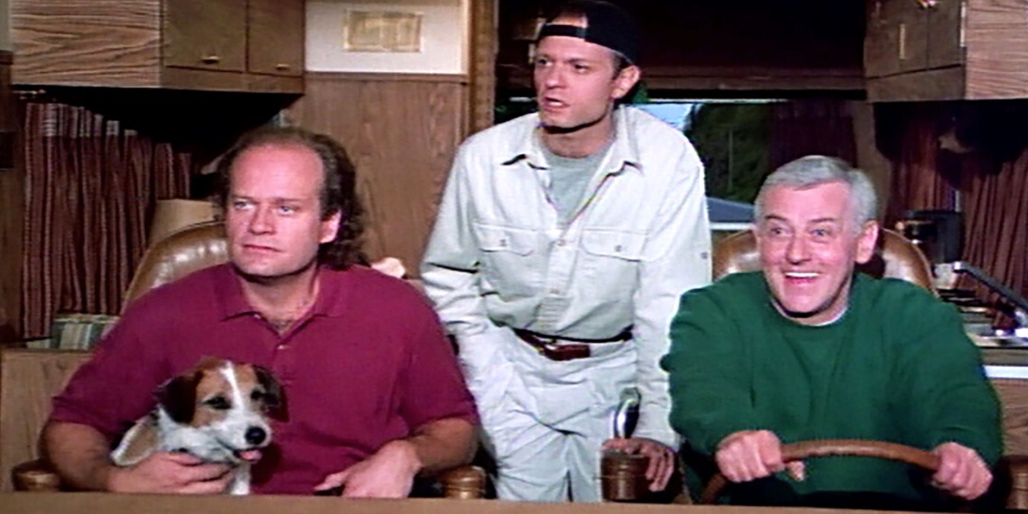 Kelsey Grammer sits in the front seat of the van and David Hyde Pierce stands between him and John Mahoney at the wheel of the Frasier.