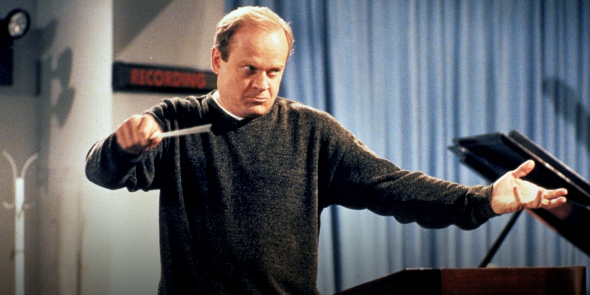 Kelsey Grammer conducting the orchestra at Fraser