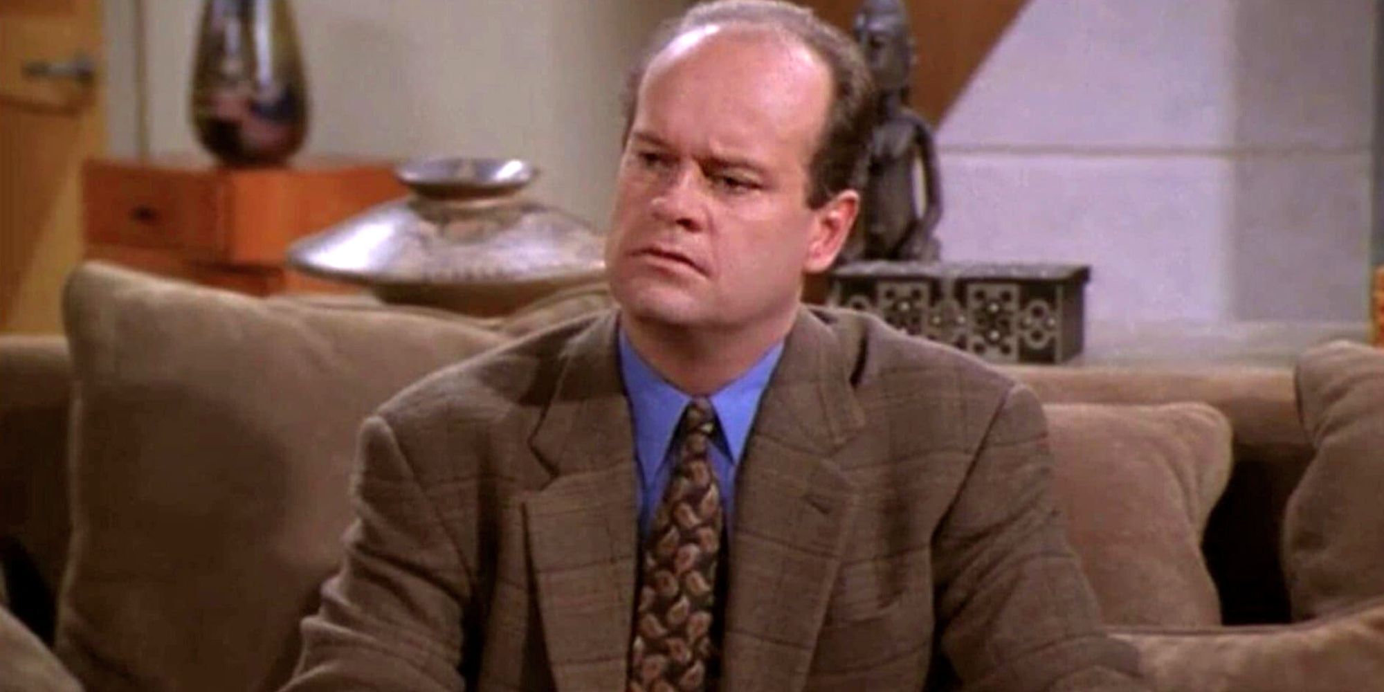 Kelsey Grammer sits alone and stares in confusion at Frazier