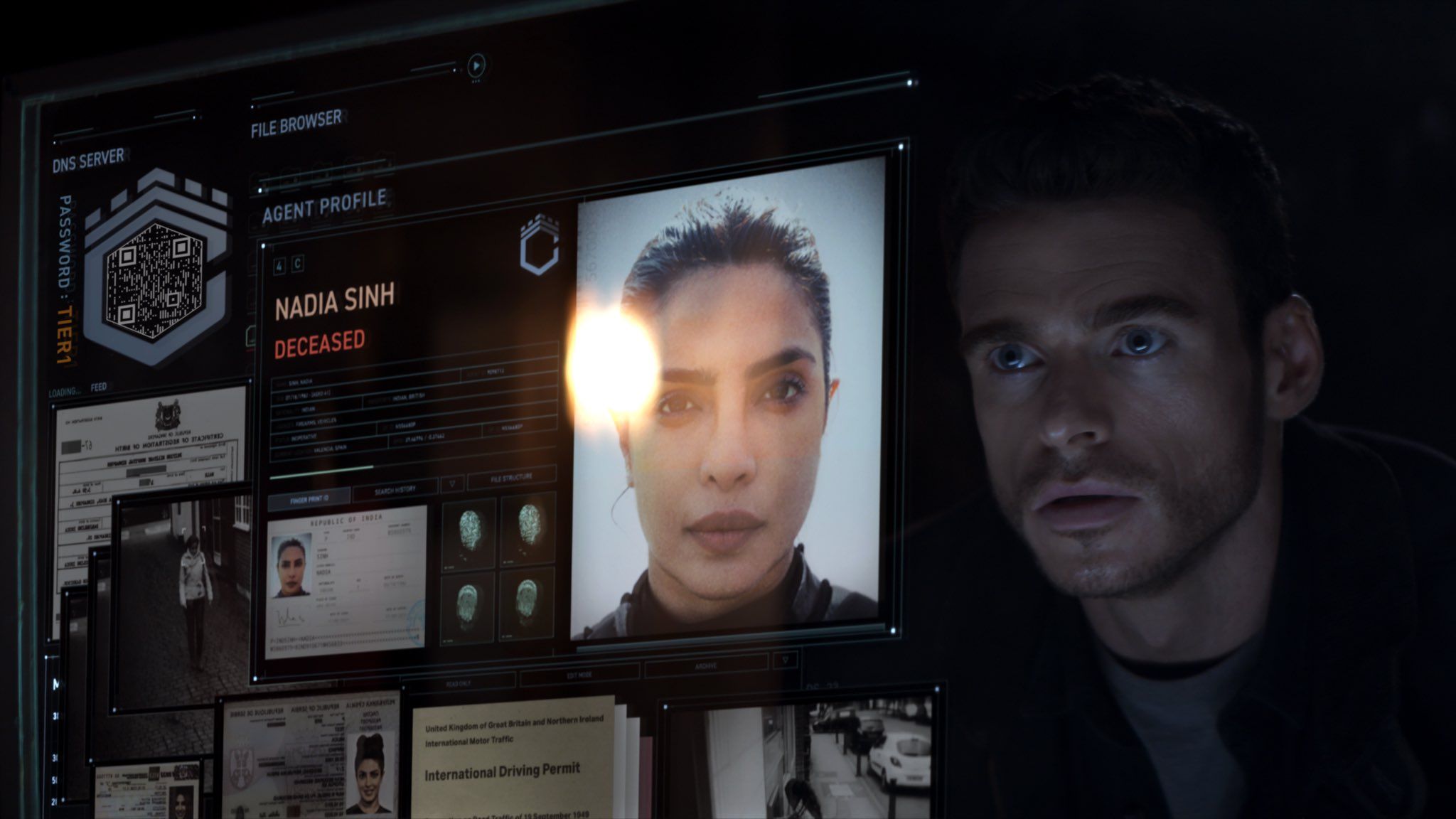 Richard Madden looks at a screen of Priyanka Chopra's face in the Citadel.