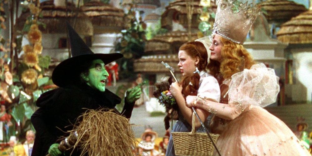 The Wicked Witch of the West threatens Dorothy and the Good Witch Glinda in The Wizard of Oz