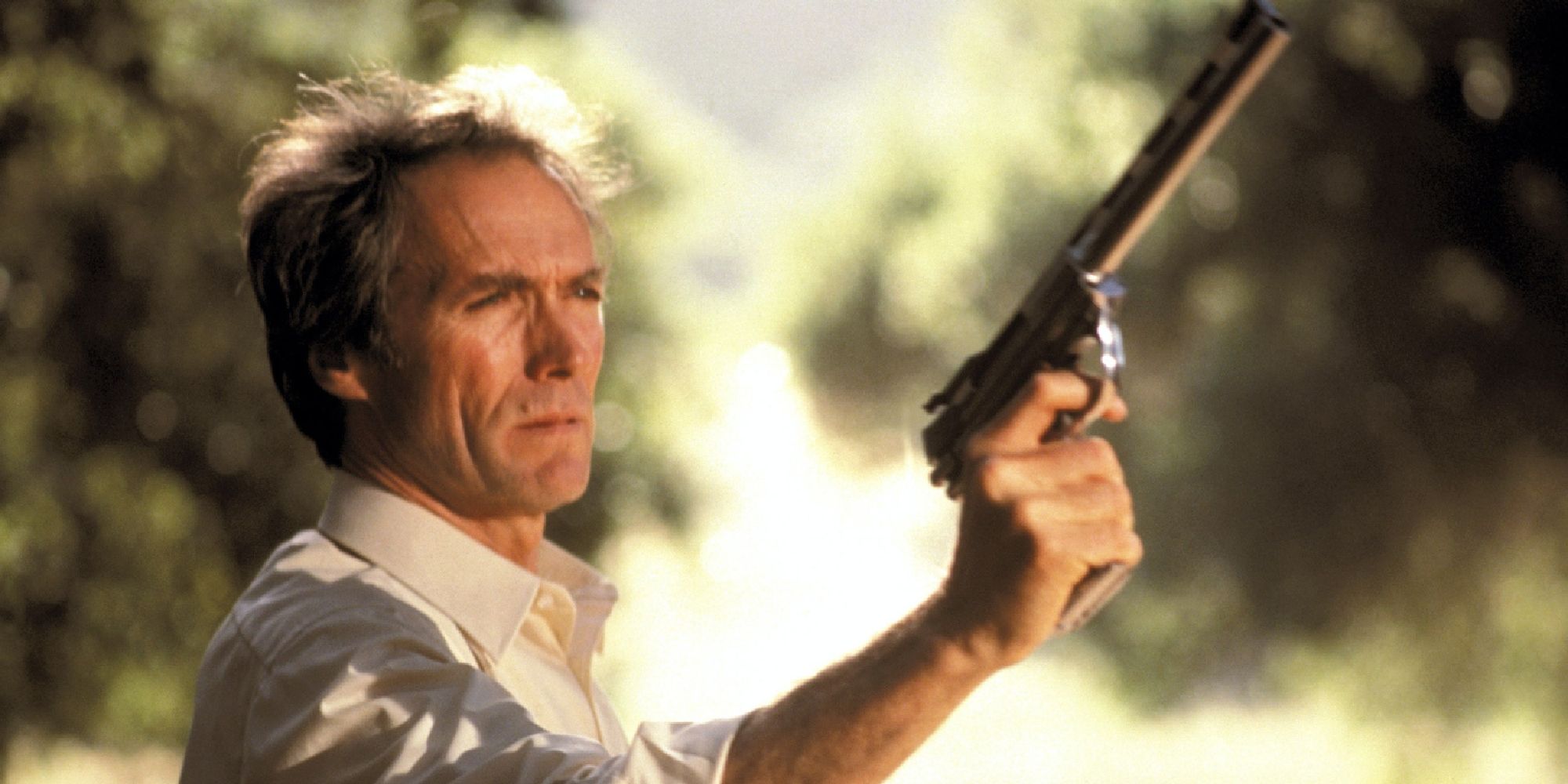 Clint Eastwood as Harry Callahan aiming his gun in Sudden Impact, 1983