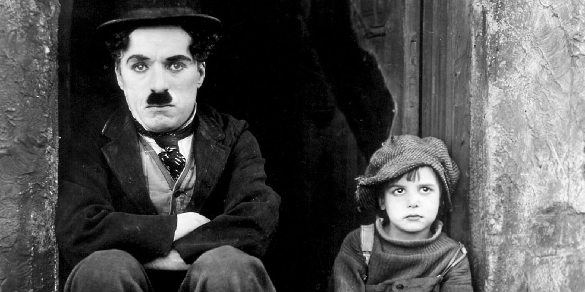Charlie Chaplin and Jackie Coogan in The Kid