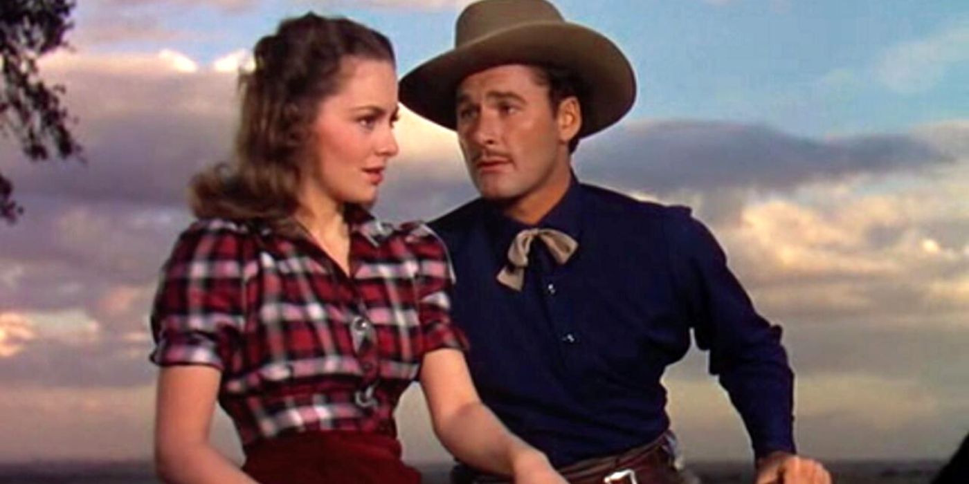 Errol Flynn looking at Olivia de Havilland in Dodge City