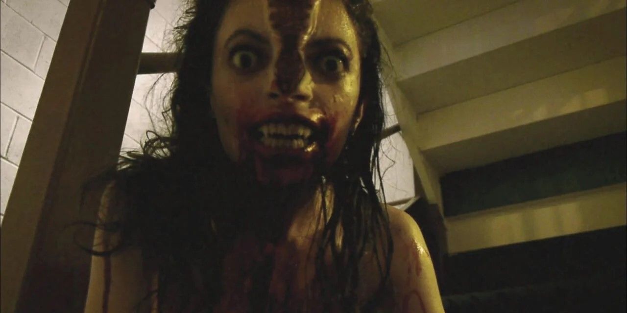V/H/S shot: The woman turns into a monster with her head splitting in two.