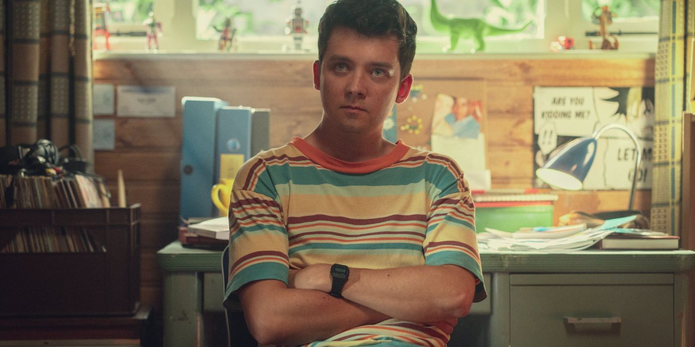 Otis (Asa Butterfield) sits with his arms crossed in the fourth season of Sex Education.