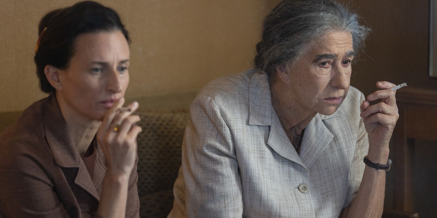 Camille Cotten as Lou Kaddar and Helen Mirren as Golda Meir in Golda. 