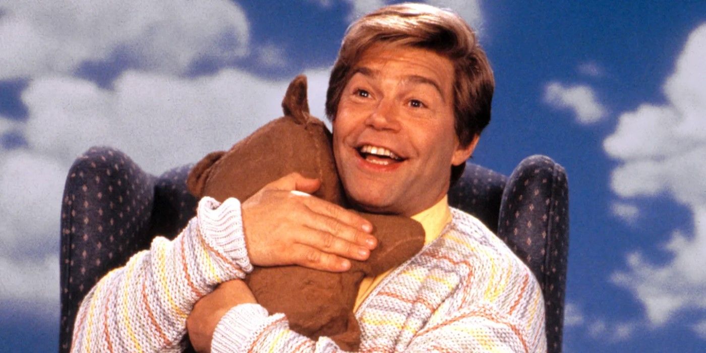Stuart Smalley hugs a teddy bear in Stuart Saves His Family.