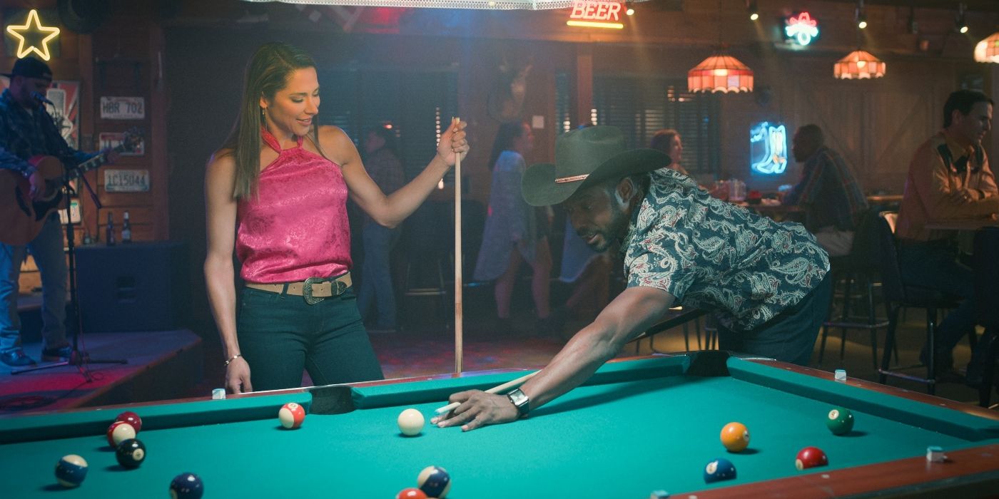 Genevieve (Nikki Estridge) and Eric (Dion Johnston) play pool in season 3, episode 8 of Steel Magnolias.
