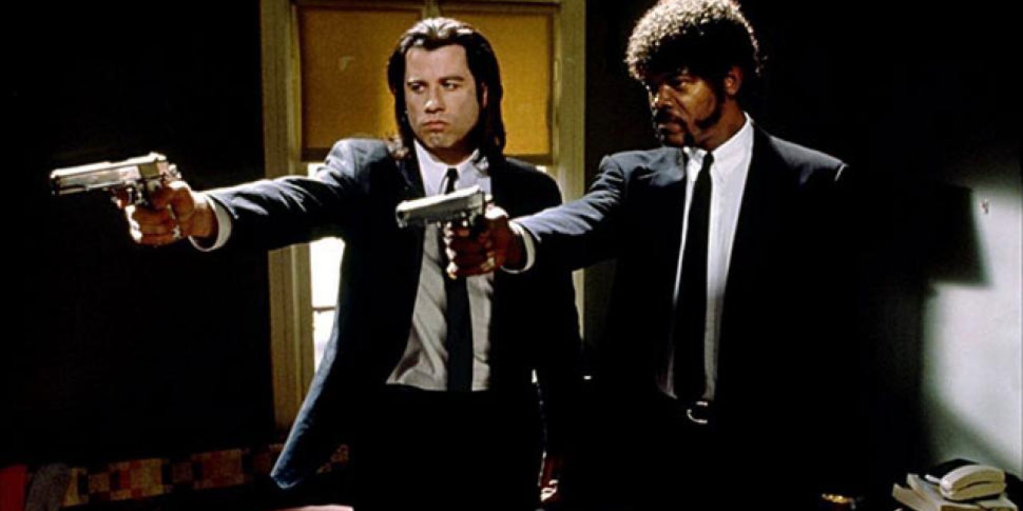 Two men raise their weapons in Pulp Fiction.