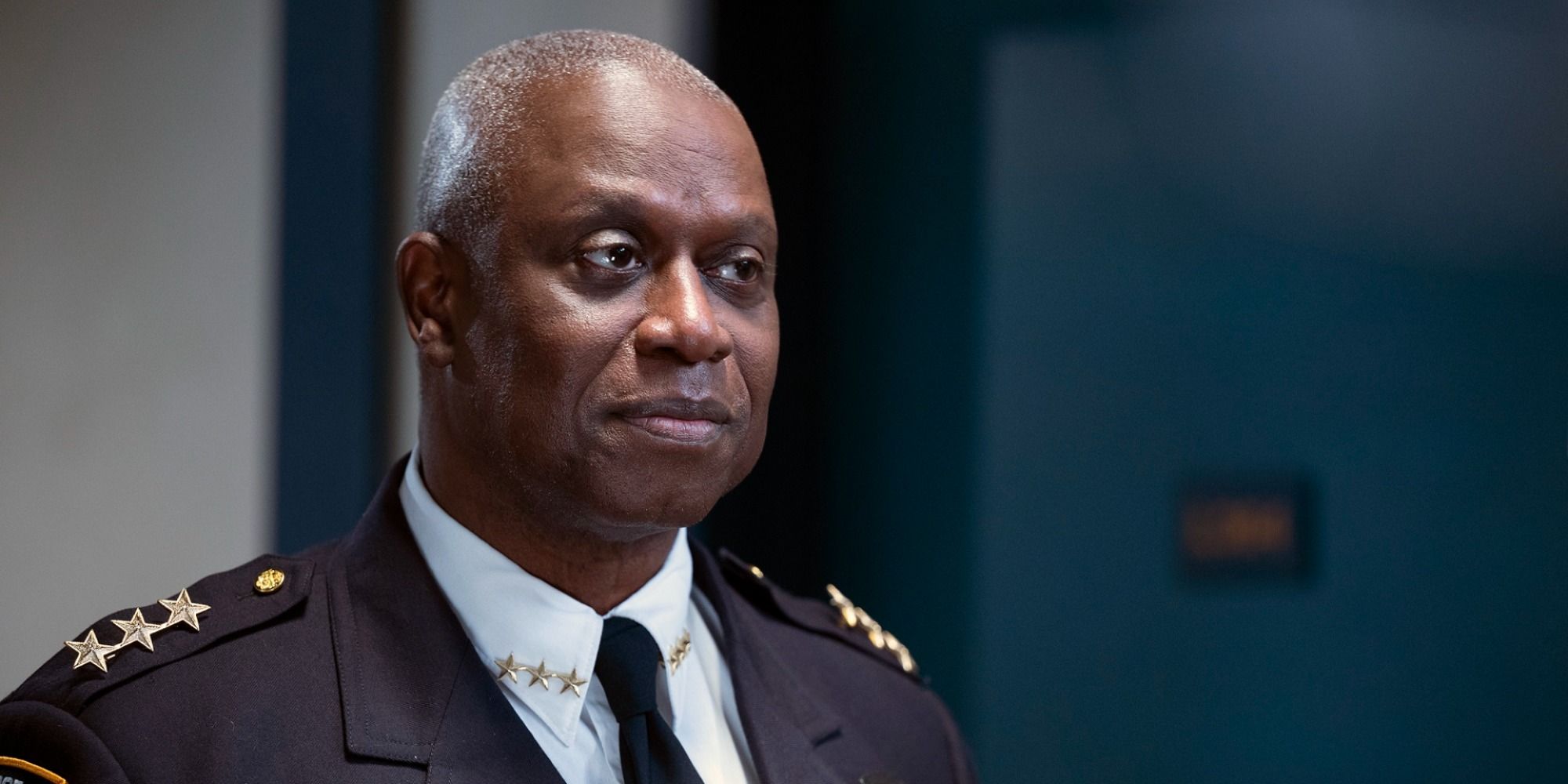 Captain Raymond Holt smiles subtly in uniform at Brooklyn Nine-Nine