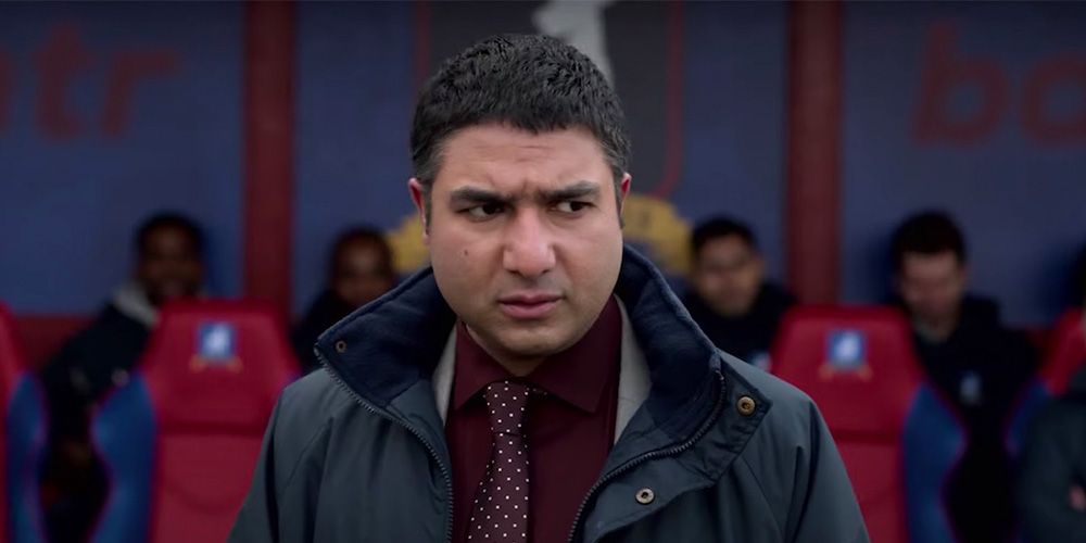 Nate looks upset in a scene from Ted Lasso.