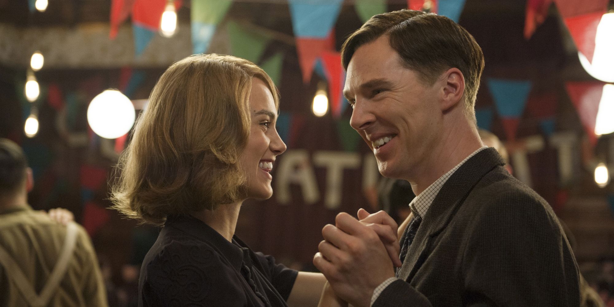 Joan Clark and Alan Turing dance and laugh in a simulation game