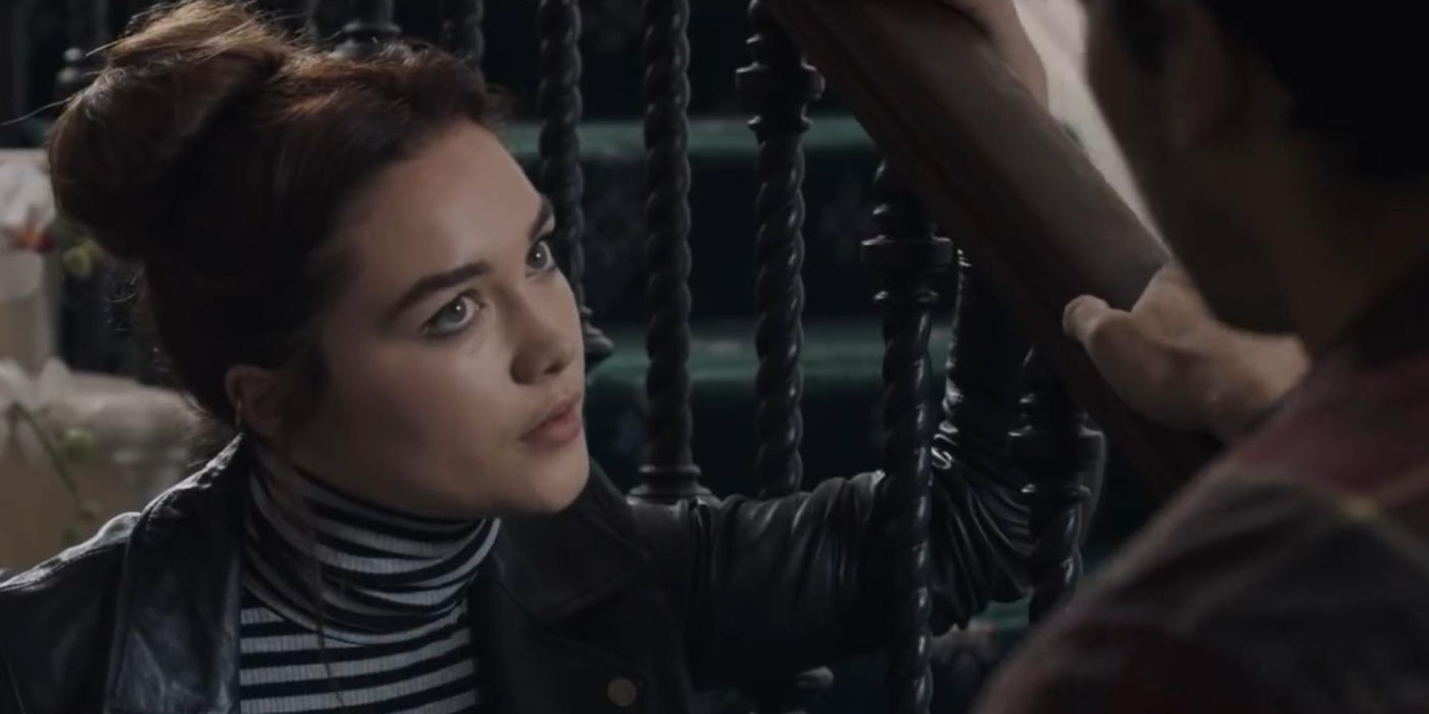 Woman talking to another man on the stairs