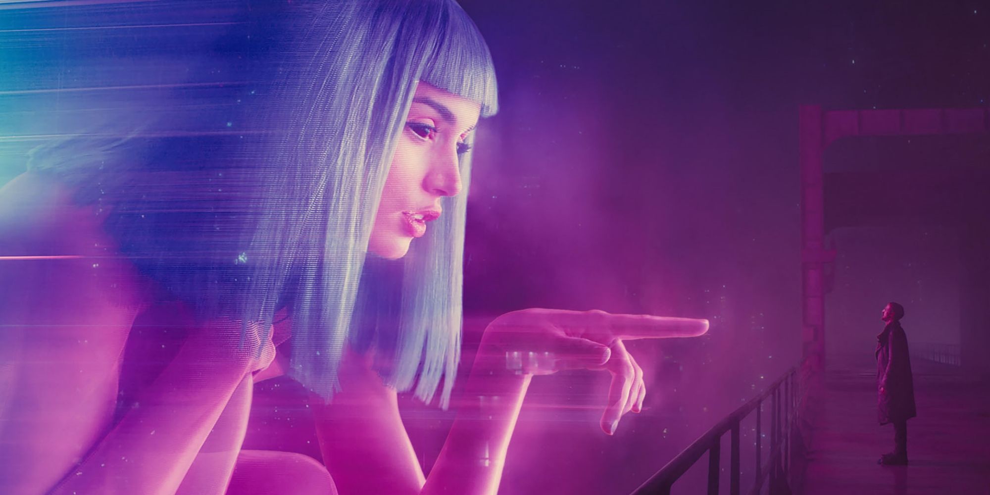 Kay (Ryan Gosling) stands under a hologram of Joy (Ana de Armas) in Blade Runner 2049 (2017)