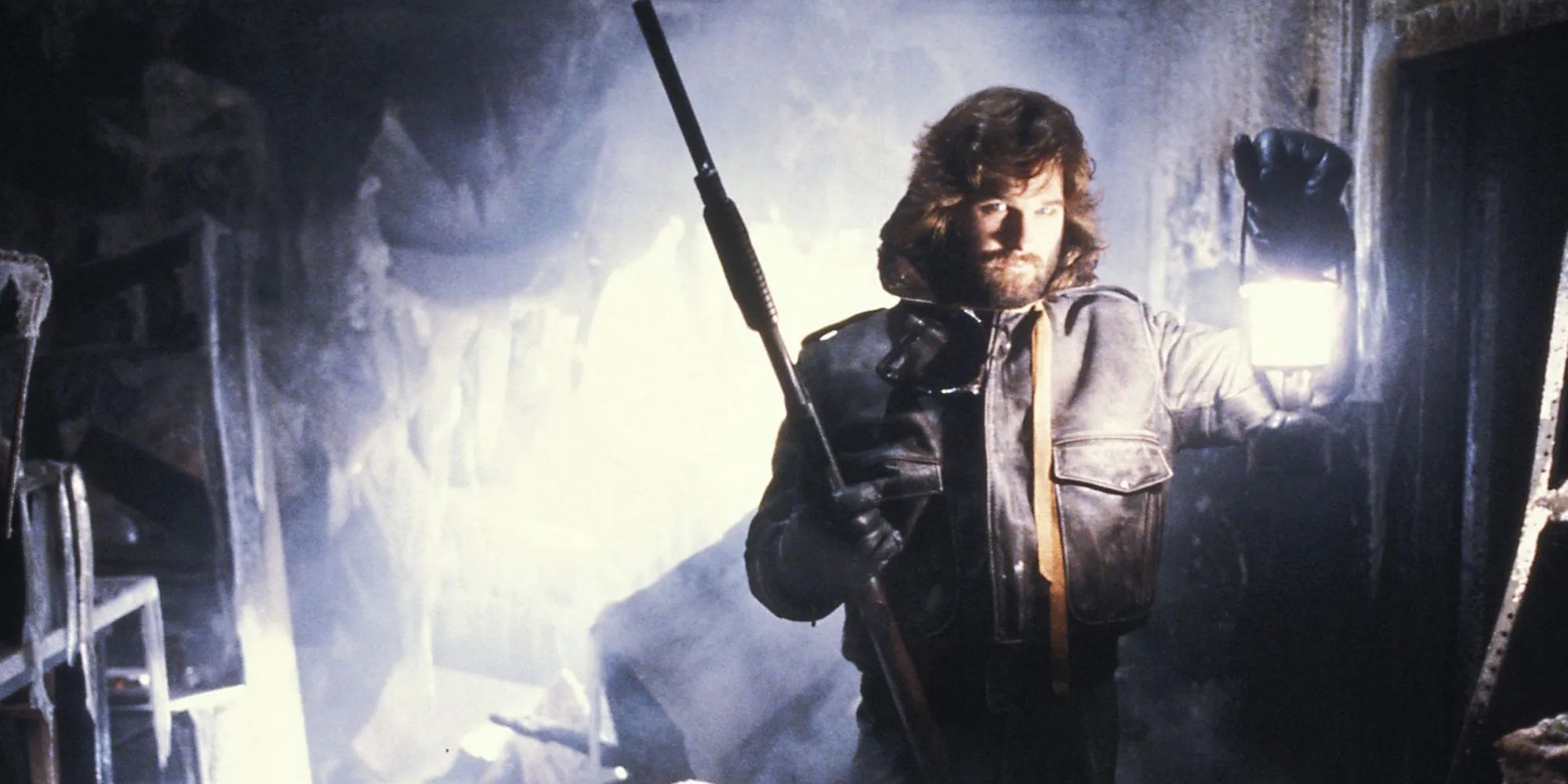 McReady (Kurt Russell) holding a lantern in The Thing (1982)