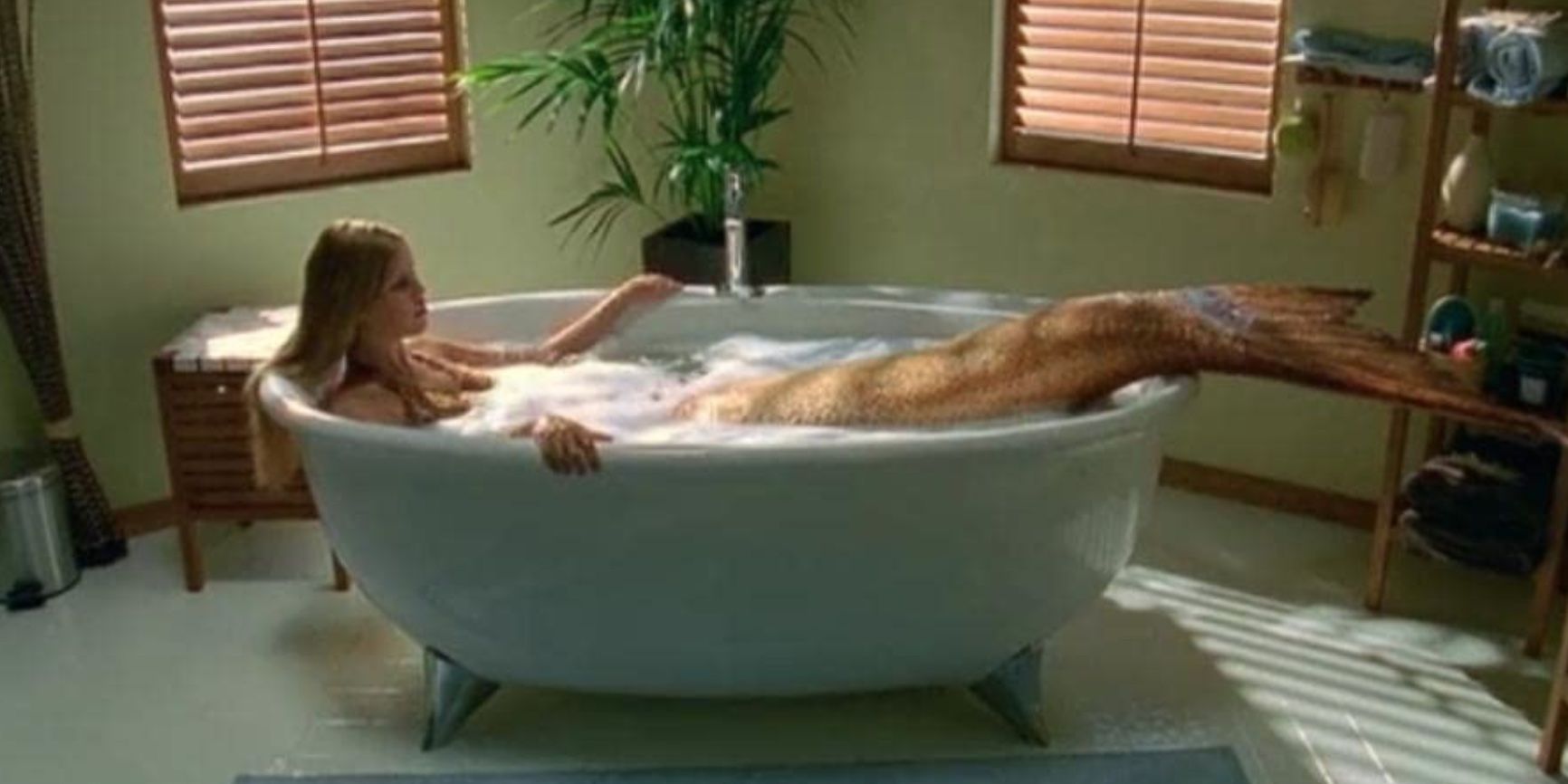 Claire Holt as a mermaid in H2O: Just Add Water.