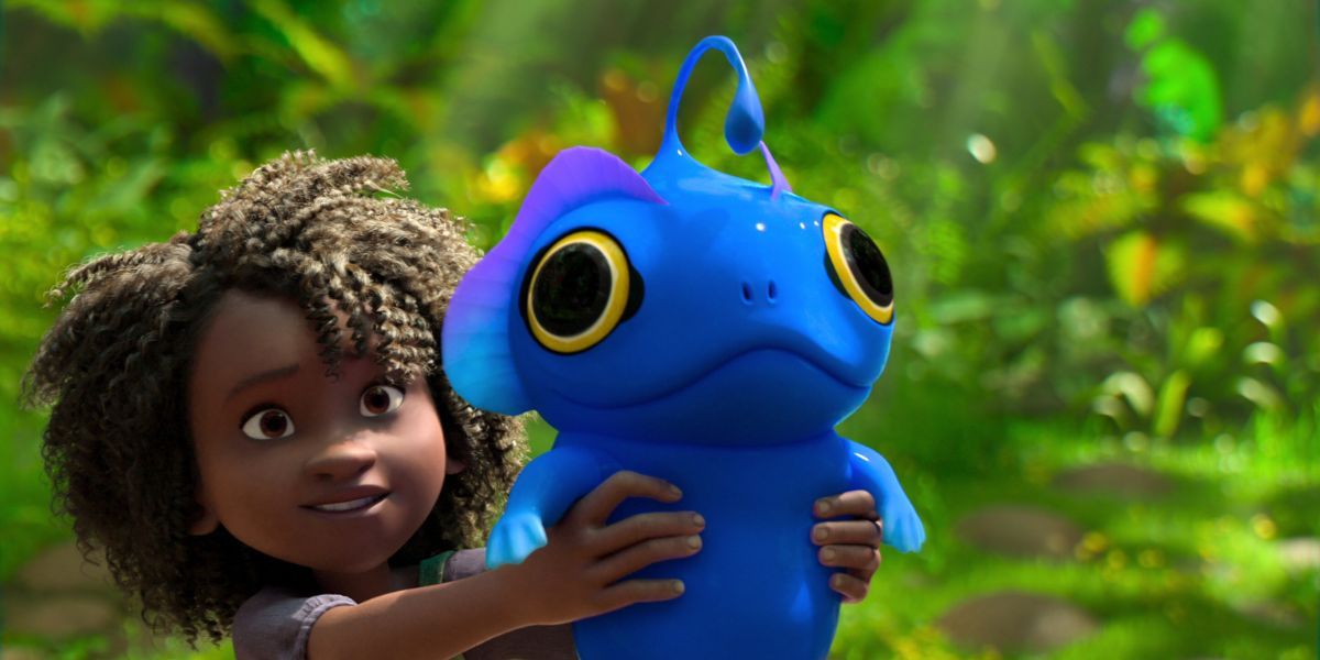 Young girl holding a blue creature