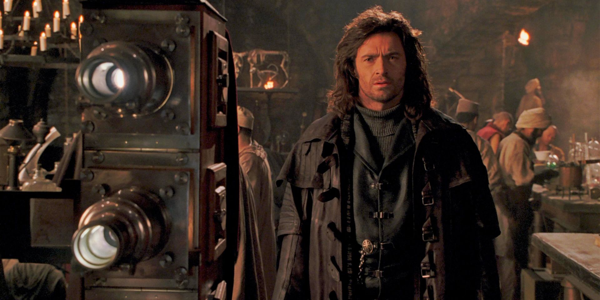 Hugh Jackman as Van Helsing stands next to a camera projector in Van Helsing.
